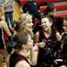 Milan junior cheerleader Katie Sabo laughs at halftime on Friday. Daniel Brenner I AnnArbor.com